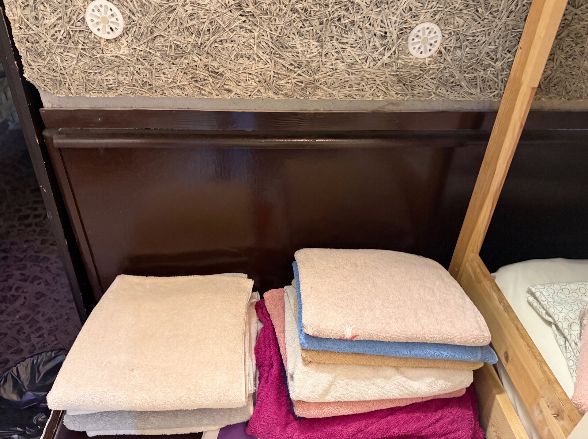 Fresh guest towels provided beside the sleeping area