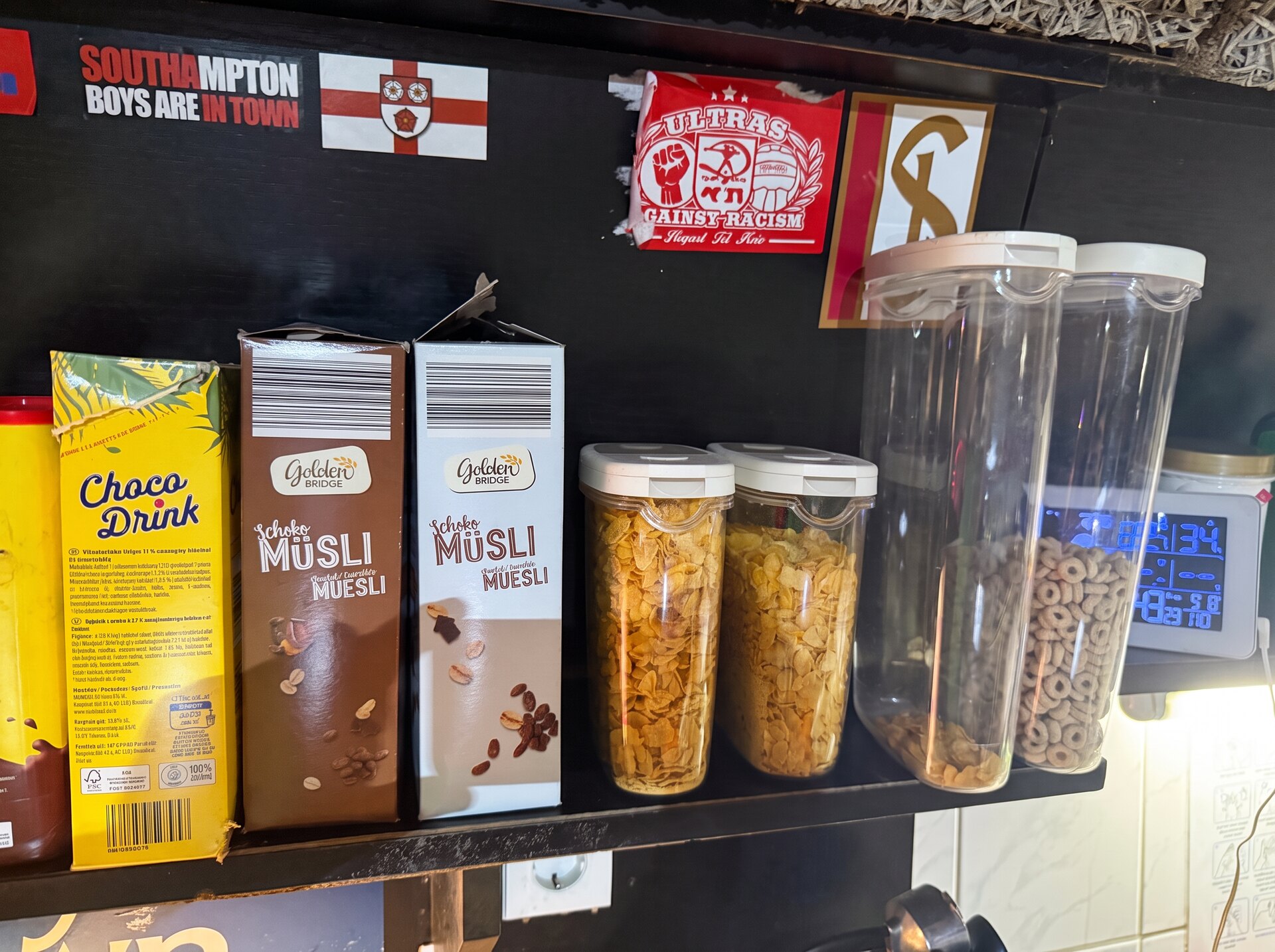 Breakfast shelf stocked with cereals and muesli