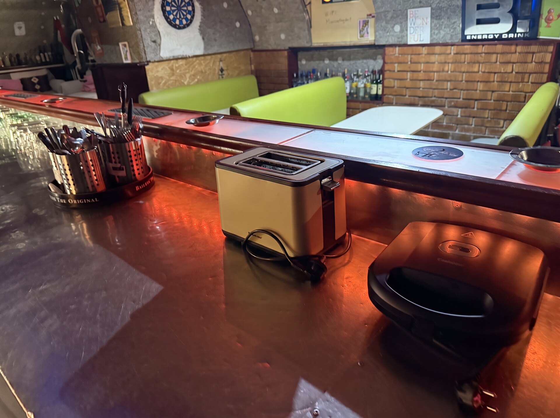 Bar counter with toaster, sandwich press and utensils